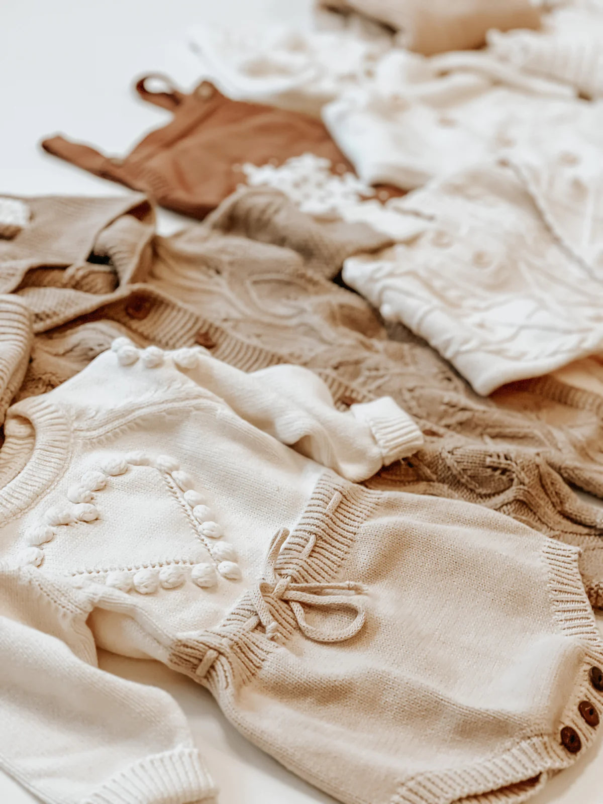 HEART KNITTED BODYSUIT